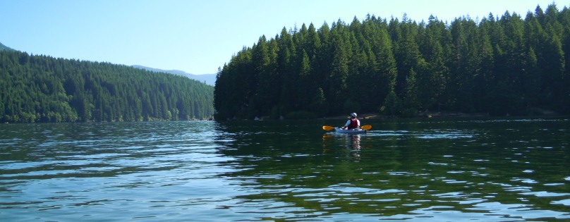 A kayaker on Detroit Lake near Piety Island
